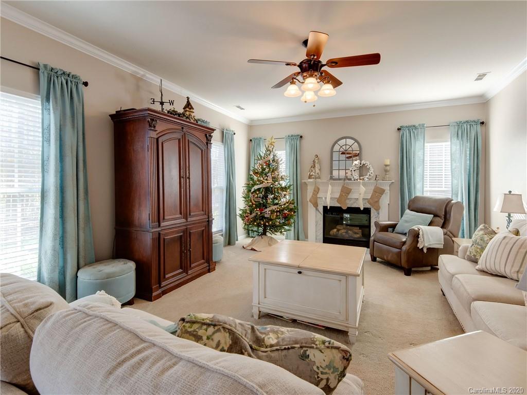 3028 Strawberry Road Matthews, NC 28104 - Photo 22 of 44 a living room with furniture ceiling fan and a window