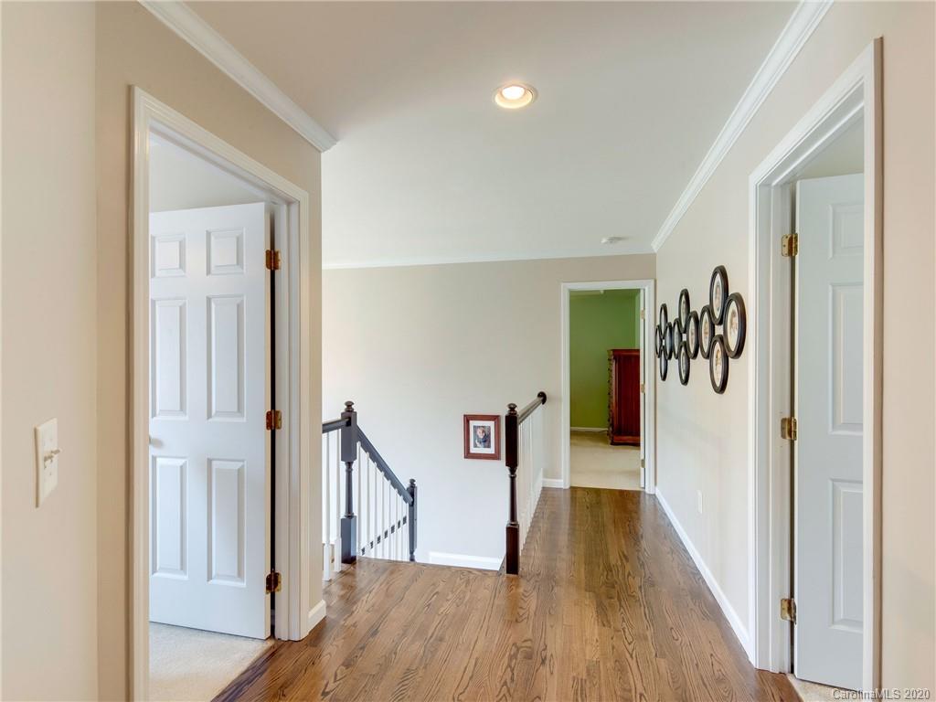 3028 Strawberry Road Matthews, NC 28104 - Photo 24 of 44 a view of hallway with wooden floor