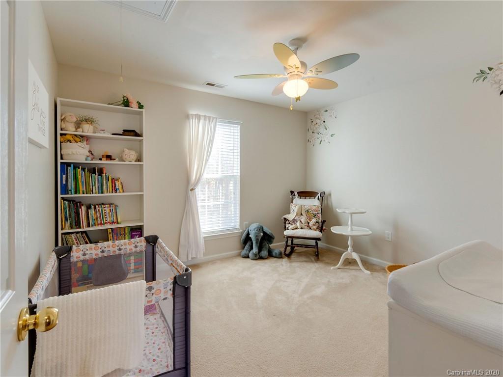 3028 Strawberry Road Matthews, NC 28104 - Photo 29 of 44 a living room with furniture and a window
