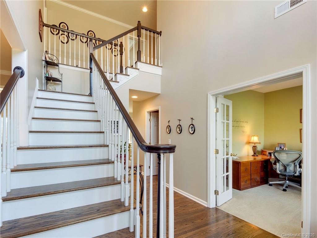 3028 Strawberry Road Matthews, NC 28104 - Photo 4 of 44 a view of entryway and hall with wooden floor