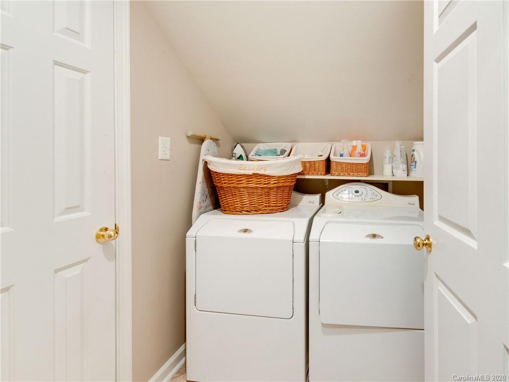 3028 Strawberry Road Matthews, NC 28104 - Photo 34 of 44 a utility room with dryer and washer