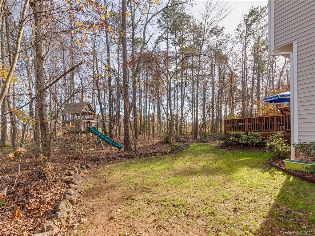 3028 Strawberry Road Matthews, NC 28104 - Photo 39 of 44 a view of a backyard with swimming pool