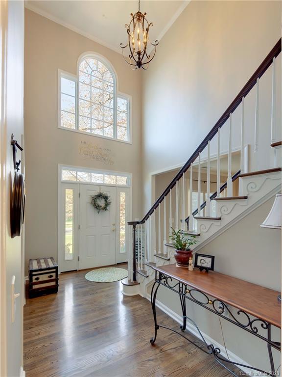 3028 Strawberry Road Matthews, NC 28104 - Photo 6 of 44 a view of entryway with wooden floor and stairs