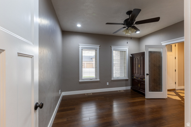 3565 West 1350th Street North Vernal, UT 84078 - Photo 16 of 54 Interior room featuring wood-finish flooring, two windows with blinds, a ceiling fan with integrated lighting, and recessed ceiling lights