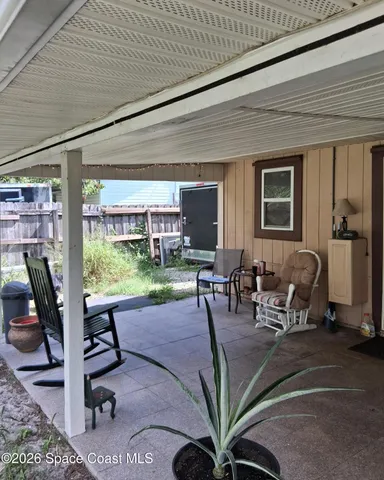 a utility room with cabinets washer and dryer