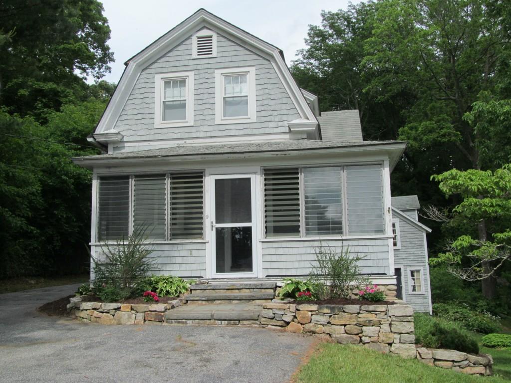 9 Riverside Place Ledyard, CT 06335 - Photo 1 of 1 a front view of a house with a yard and outdoor seating