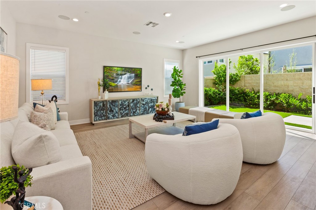 181 Mulberry Lake Forest, CA 92630 - Photo 13 of 46 a living room with furniture and a large window
