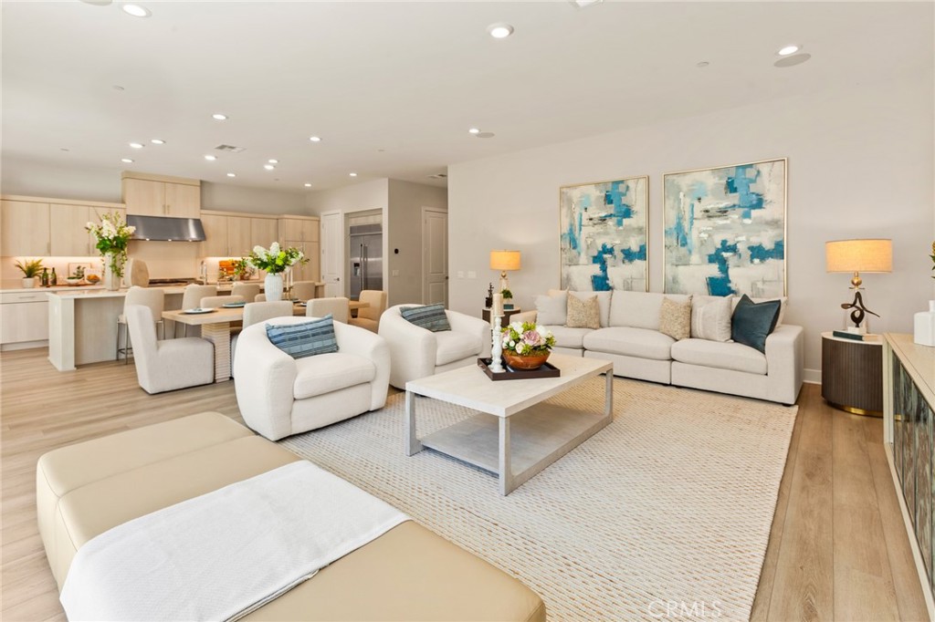 181 Mulberry Lake Forest, CA 92630 - Photo 16 of 46 a living room with furniture white walls and a rug