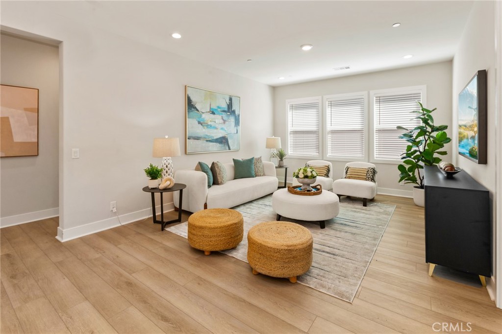 181 Mulberry Lake Forest, CA 92630 - Photo 20 of 46 a living room with furniture and a potted plant