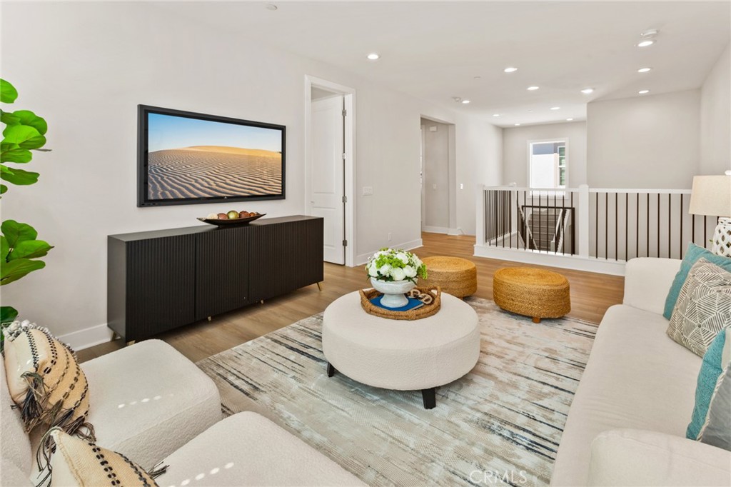 181 Mulberry Lake Forest, CA 92630 - Photo 22 of 46 a living room with furniture and a flat screen tv