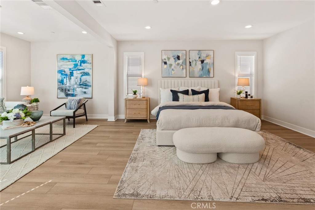 181 Mulberry Lake Forest, CA 92630 - Photo 24 of 46 a bedroom with a large bed and a couch