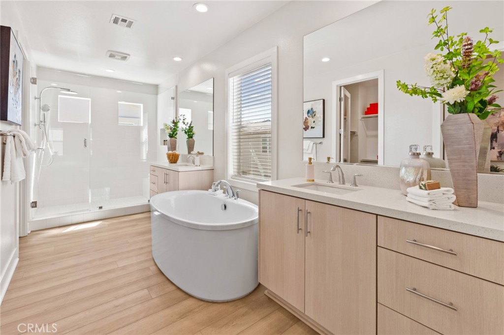 181 Mulberry Lake Forest, CA 92630 - Photo 27 of 46 a spacious bathroom with a double vanity sink mirror and bathtub