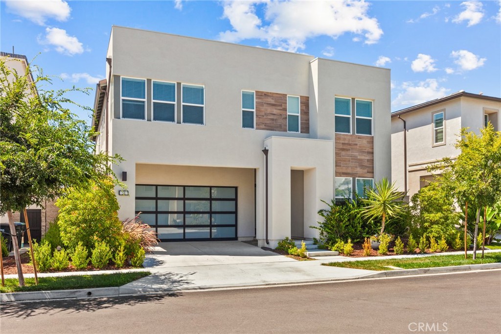 181 Mulberry Lake Forest, CA 92630 - Photo 3 of 46 a front view of a house with a garden