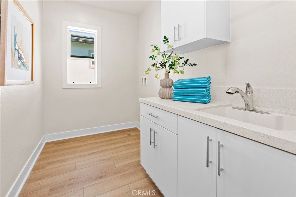 181 Mulberry Lake Forest, CA 92630 - Photo 31 of 46 a bathroom with a sink and a mirror
