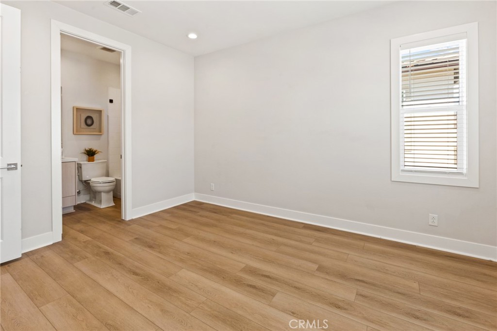 181 Mulberry Lake Forest, CA 92630 - Photo 37 of 46 a view of a room with wooden floor and a bathroom