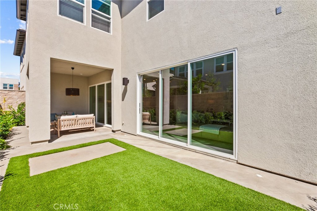 181 Mulberry Lake Forest, CA 92630 - Photo 46 of 46 a view of an house with backyard porch and floor to ceiling window