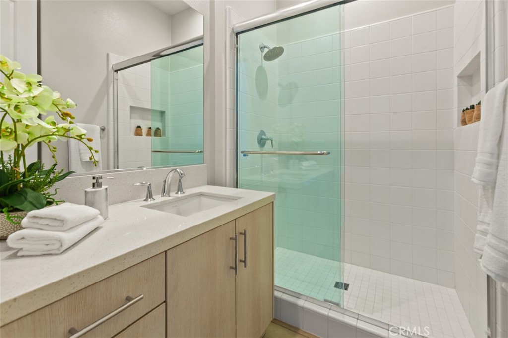181 Mulberry Lake Forest, CA 92630 - Photo 5 of 46 a bathroom with a granite countertop sink and a mirror