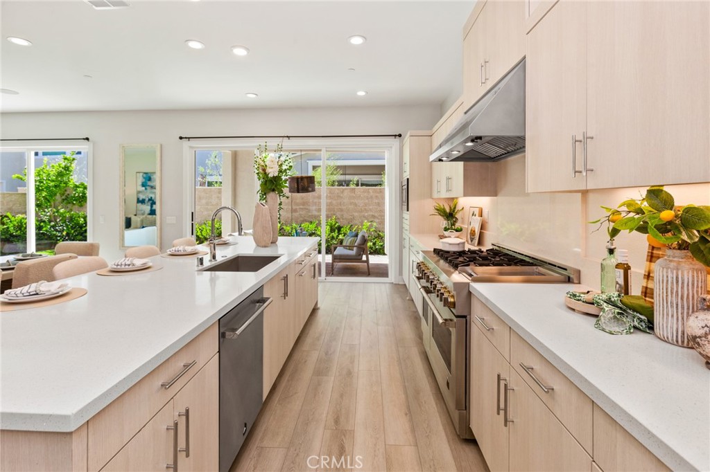181 Mulberry Lake Forest, CA 92630 - Photo 10 of 46 a kitchen with a sink stove and cabinets