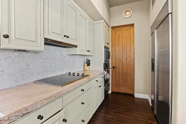 a bed room with a bed and a dresser