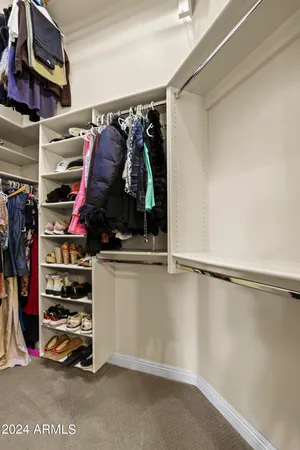 a view of a lake with a house in the background