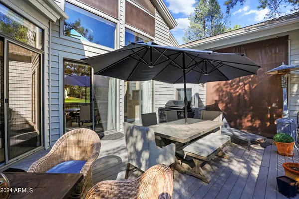 a view of a wooden deck with a lake view