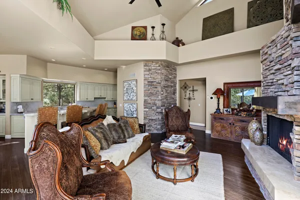 a view of living room with granite countertop furniture and fireplace