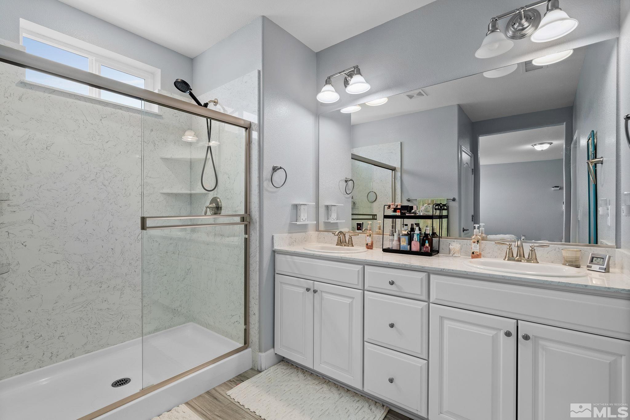 2811 McCauley Ranch Boulevard Reno, NV 89521 - Photo 29 of 40 a bathroom with a double vanity sink mirror and shower