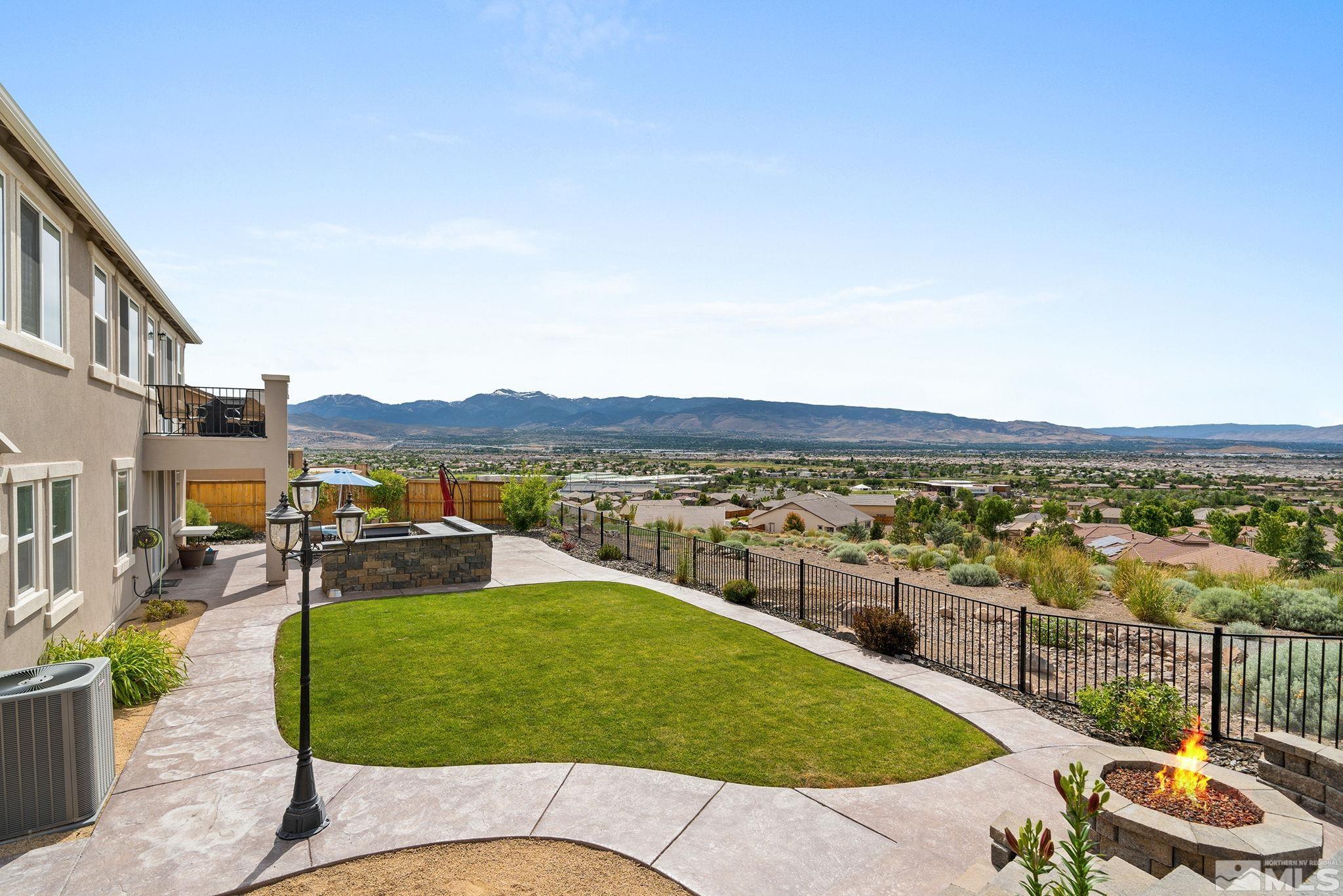 2811 McCauley Ranch Boulevard Reno, NV 89521 - Photo 39 of 40 a view of a swimming pool with a chairs and table in a patio
