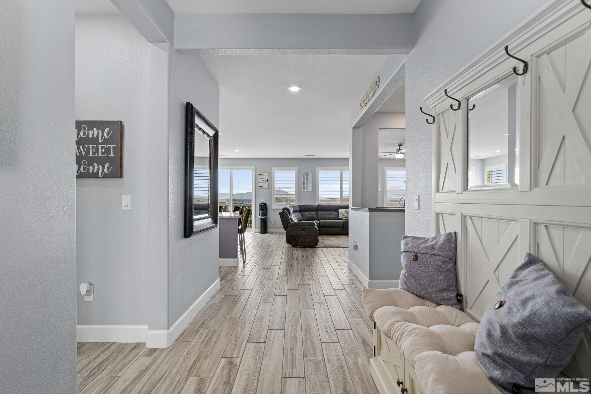 2811 McCauley Ranch Boulevard Reno, NV 89521 - Photo 8 of 40 a living room with furniture and a wooden floor