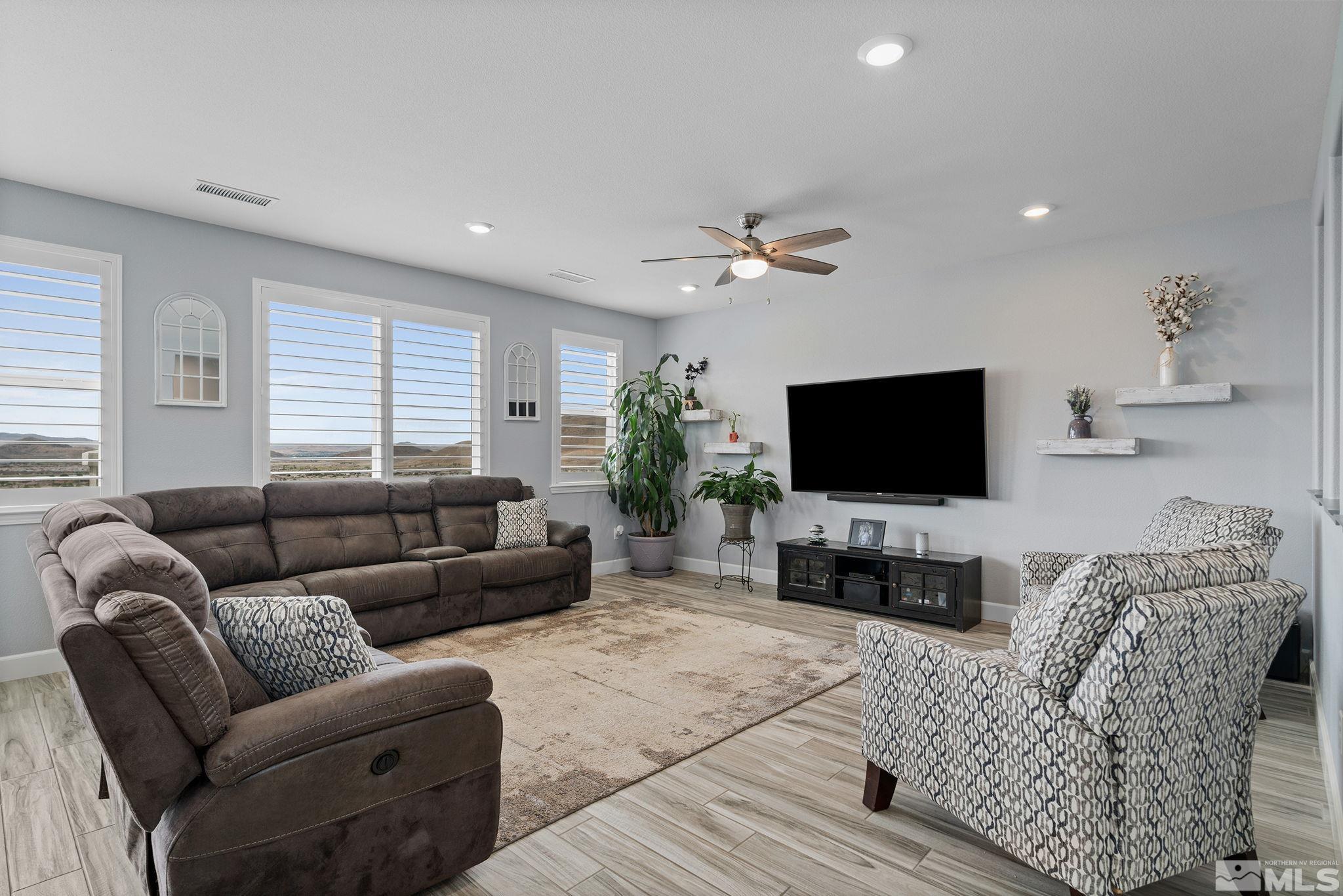 2811 McCauley Ranch Boulevard Reno, NV 89521 - Photo 9 of 40 a living room with furniture and a flat screen tv