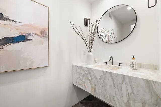 a bedroom with a bed window and a flat screen tv