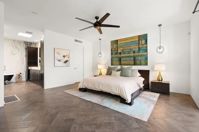 a spacious bathroom with a sink and a mirror