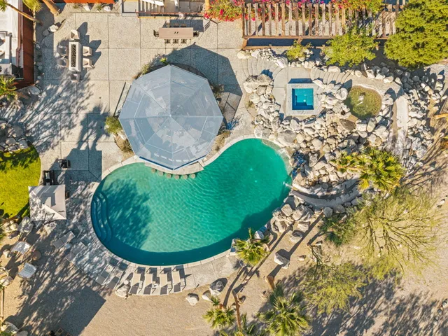 a view of a chairs and table in patio