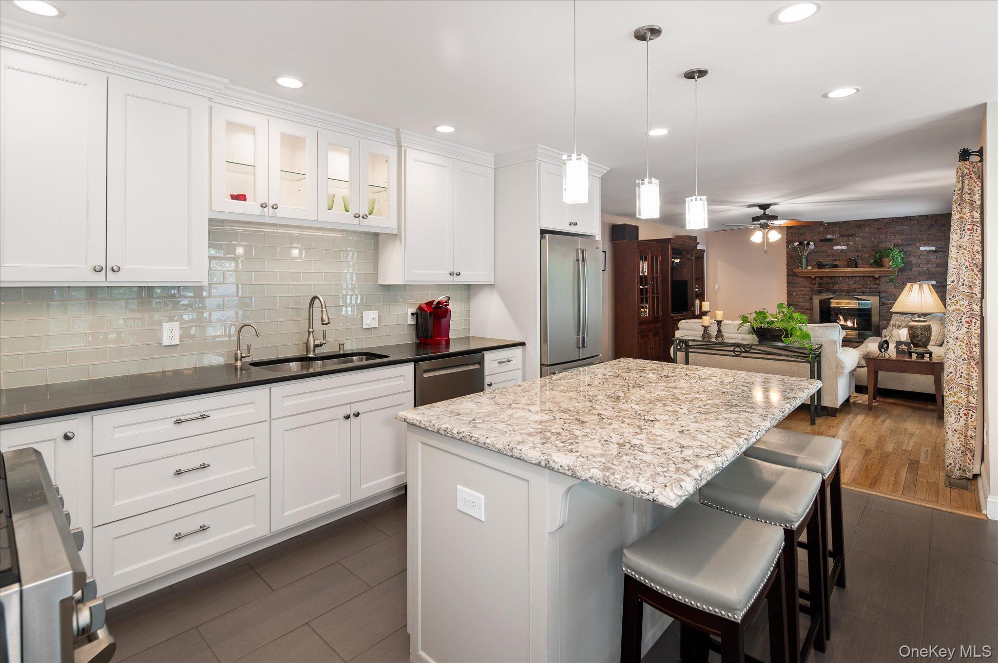 32 Watch Hill Road Croton-on-Hudson, NY 10520 - Photo 12 of 43 a kitchen with a white cabinets and chairs