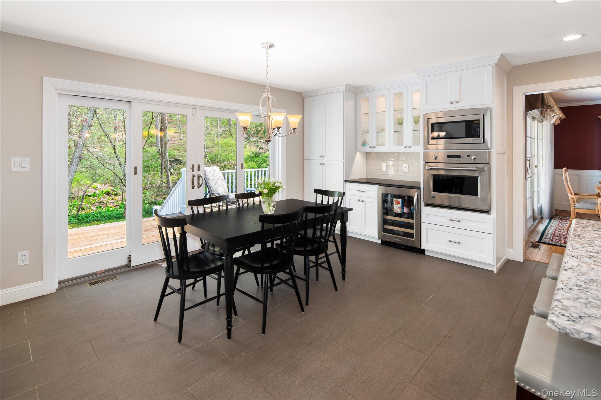 32 Watch Hill Road Croton-on-Hudson, NY 10520 - Photo 16 of 43 a view of a dining room with furniture and a kitchen
