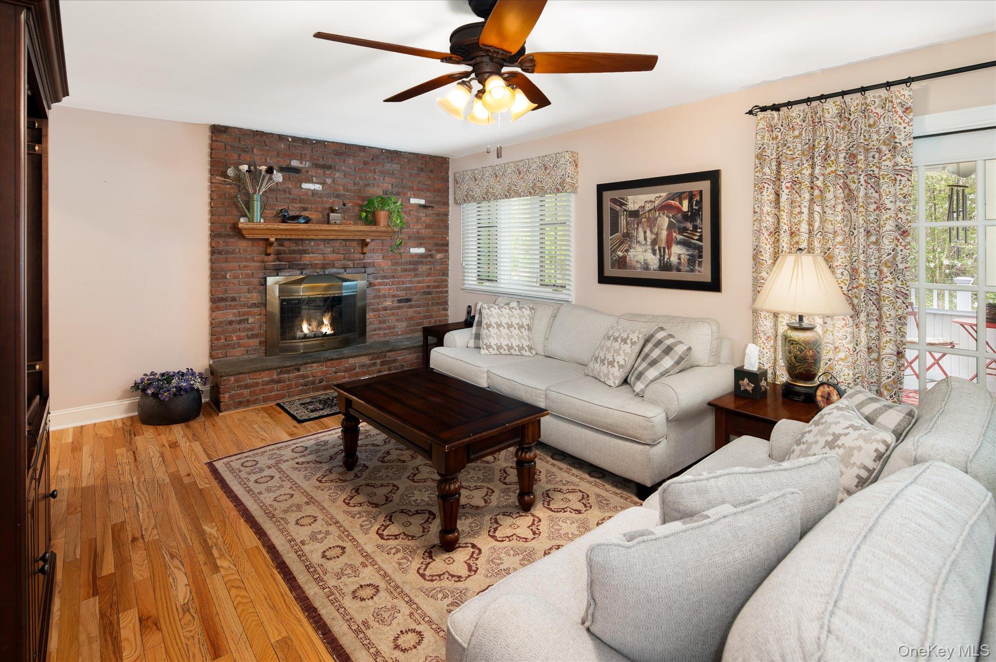 32 Watch Hill Road Croton-on-Hudson, NY 10520 - Photo 21 of 43 a living room with furniture and a fireplace