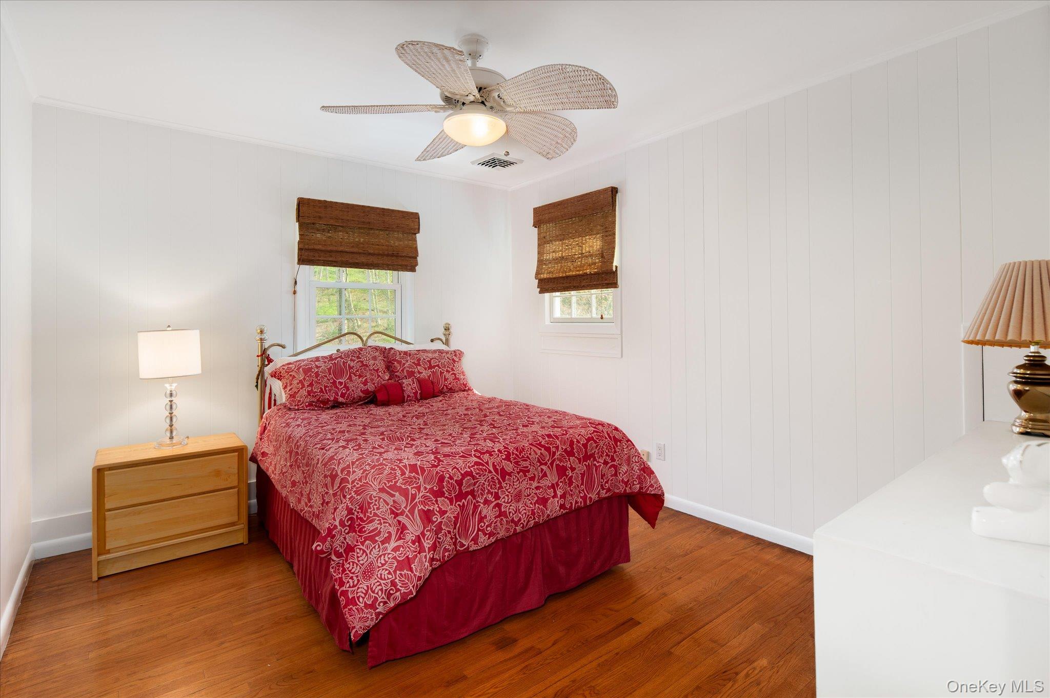 32 Watch Hill Road Croton-on-Hudson, NY 10520 - Photo 30 of 43 a bedroom with a bed and a chandelier