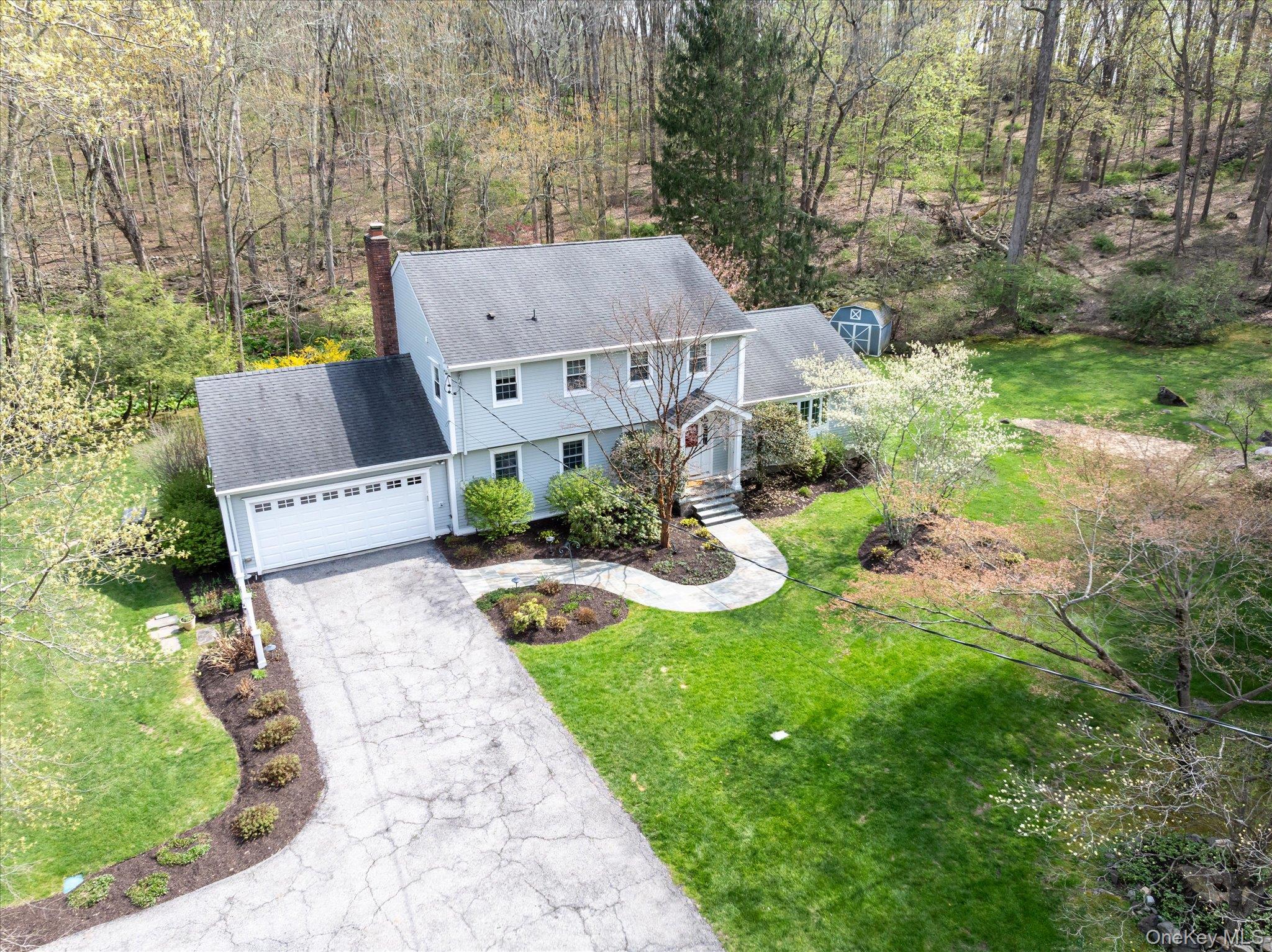 32 Watch Hill Road Croton-on-Hudson, NY 10520 - Photo 3 of 43 an aerial view of a house with swimming pool and garden