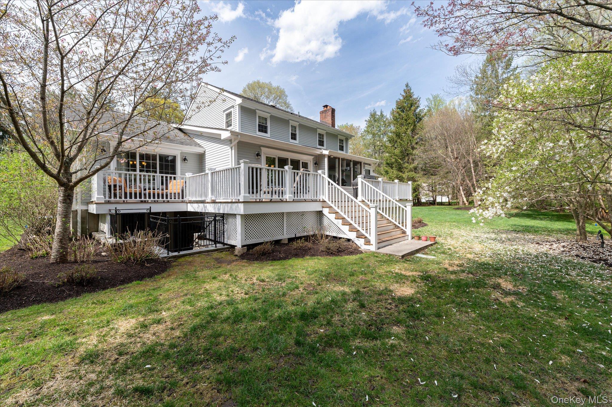 32 Watch Hill Road Croton-on-Hudson, NY 10520 - Photo 40 of 43 a view of a house with a big yard and large trees