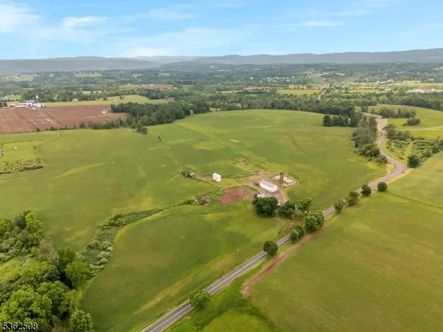 an aerial view of ocean with residential houses with outdoor space