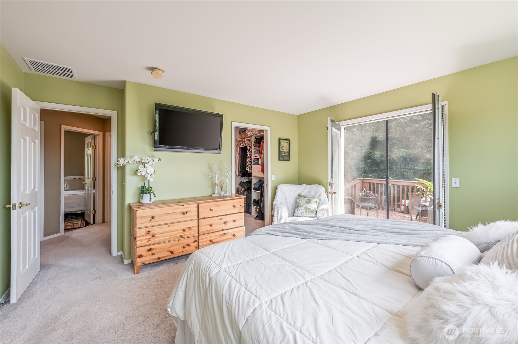 316 Easy Street Wenatchee, WA 98801 - Photo 11 of 39 a bedroom with a bed and a flat screen tv