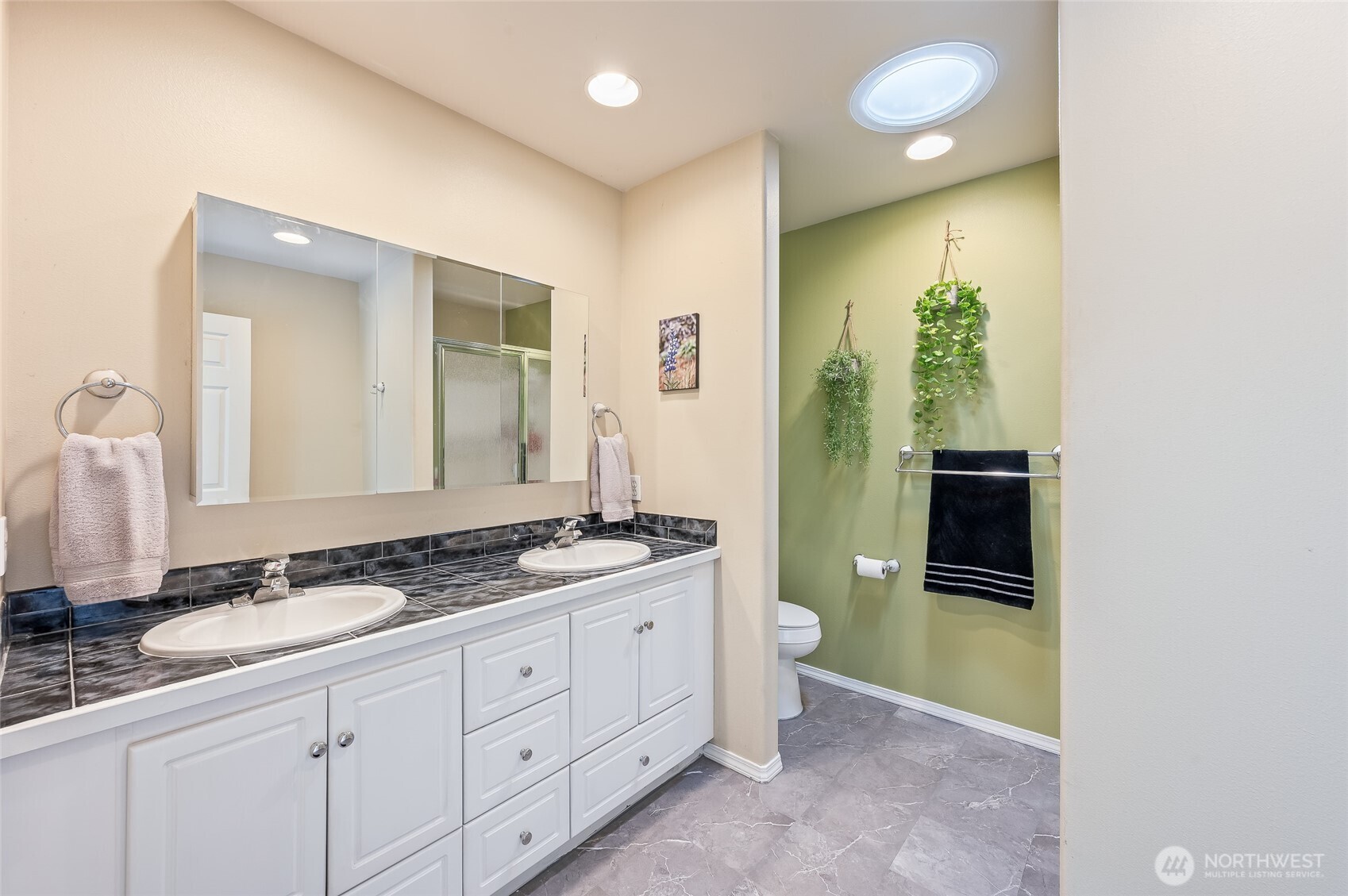 316 Easy Street Wenatchee, WA 98801 - Photo 12 of 39 a spacious bathroom with a granite countertop sink and a mirror