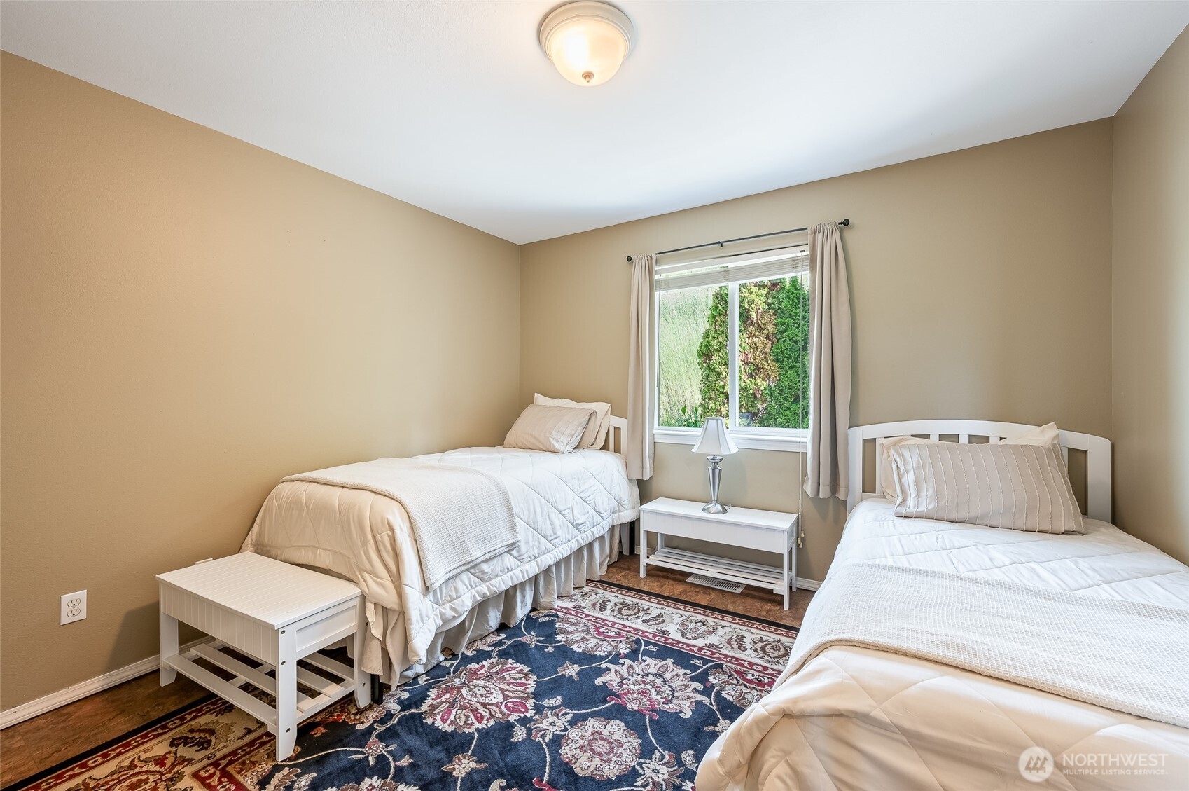 316 Easy Street Wenatchee, WA 98801 - Photo 16 of 39 a bedroom with a bed and a chair