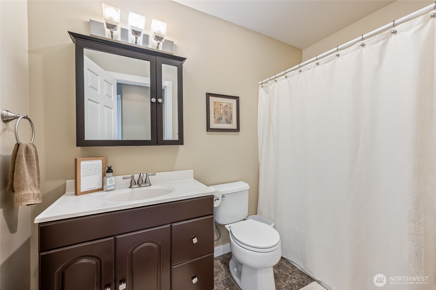 316 Easy Street Wenatchee, WA 98801 - Photo 17 of 39 a bathroom with a toilet sink and mirror