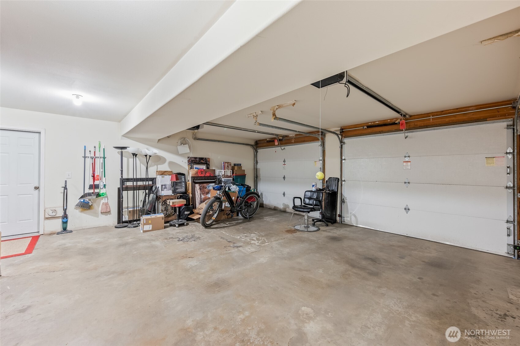 316 Easy Street Wenatchee, WA 98801 - Photo 22 of 39 a view of a garage with a bike and car