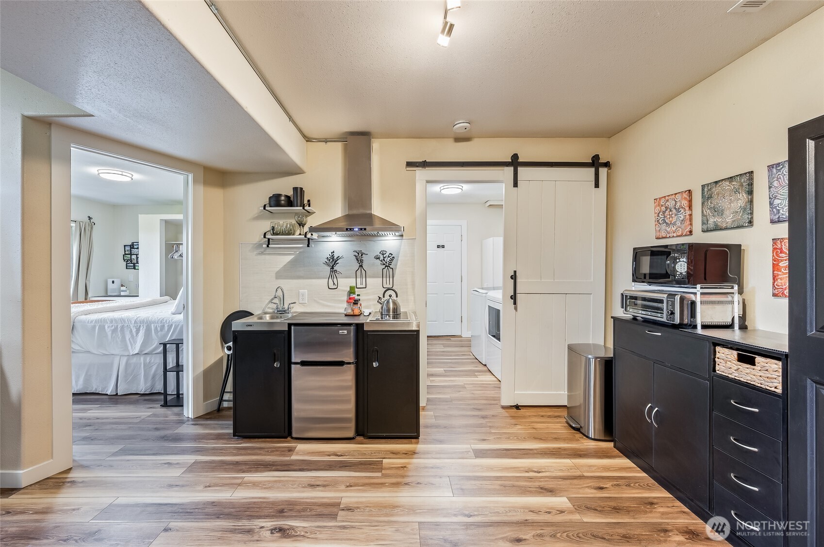316 Easy Street Wenatchee, WA 98801 - Photo 24 of 39 a kitchen with stainless steel appliances kitchen island granite countertop a refrigerator and a stove top oven