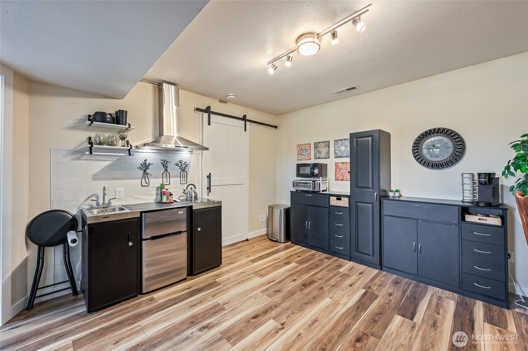 316 Easy Street Wenatchee, WA 98801 - Photo 27 of 39 a kitchen with a refrigerator and a stove top oven