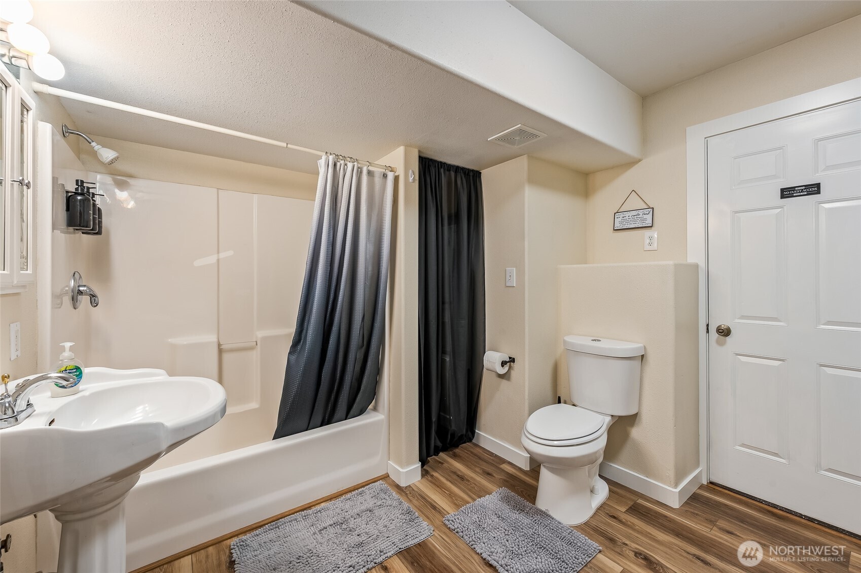 316 Easy Street Wenatchee, WA 98801 - Photo 29 of 39 a bathroom with a sink a toilet and shower