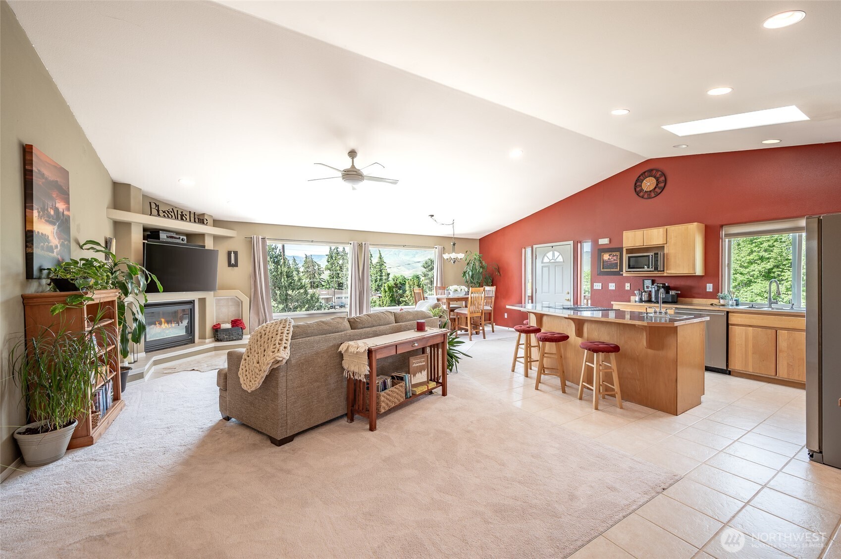316 Easy Street Wenatchee, WA 98801 - Photo 4 of 39 a living room with furniture a flat screen tv and a large window