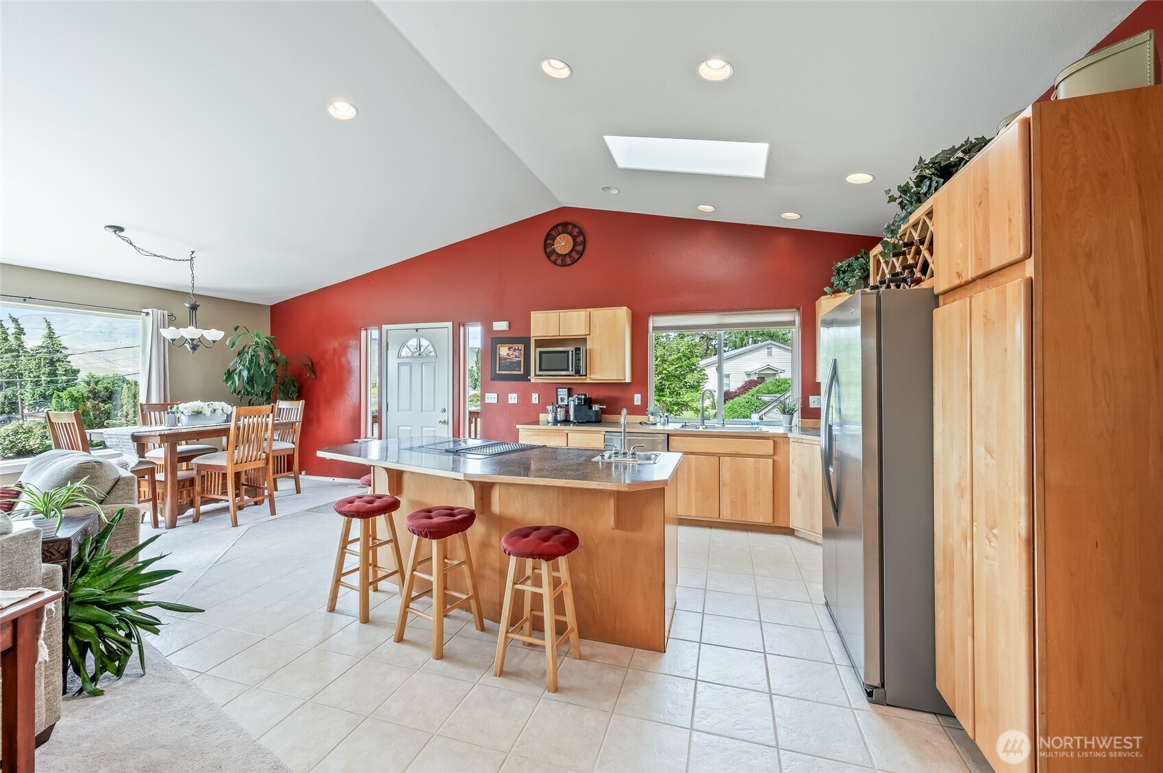 316 Easy Street Wenatchee, WA 98801 - Photo 6 of 39 a kitchen with stainless steel appliances a dining table chairs and a large window